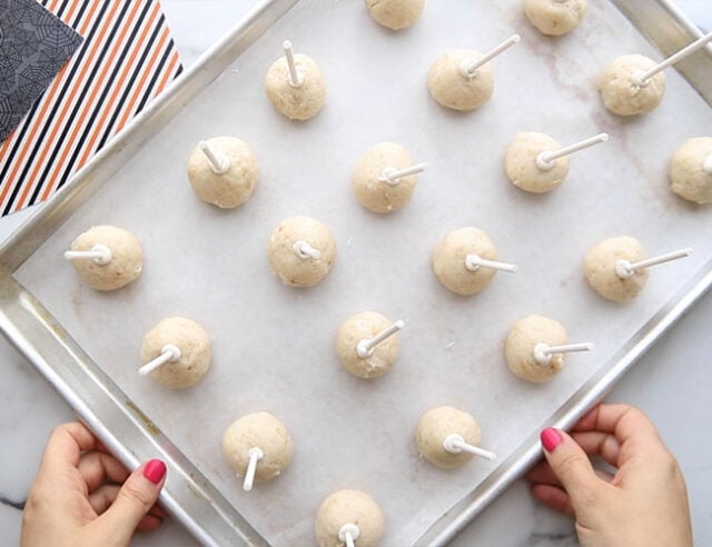 Put candy sticks into cake balls