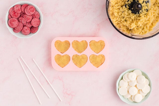 Add cake into heart molds