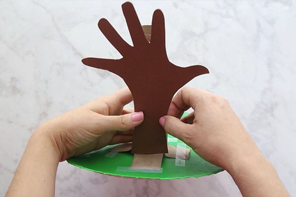 Glue Handprint on Paper Towel Tube