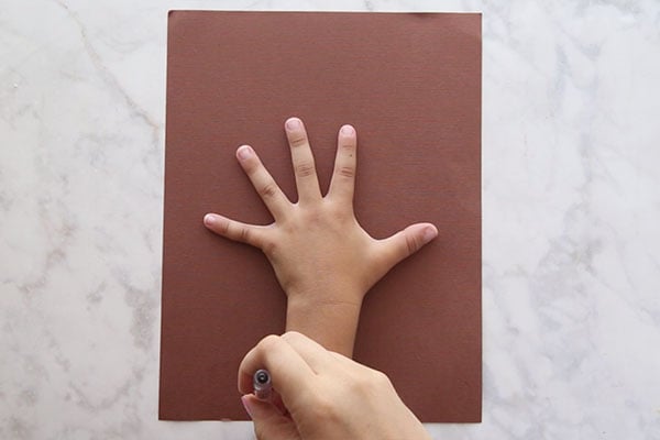 Trace hand on Brown Paper