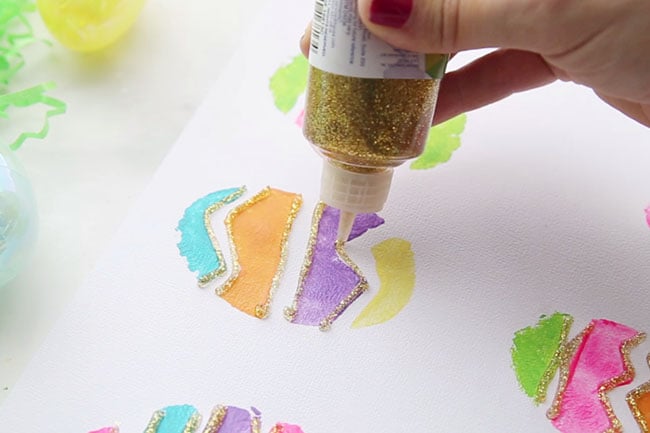 Add Glitter Glue to Potato Stamped Easter Eggs