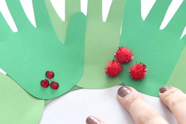 Glue Pom Poms to Handprint Wreath