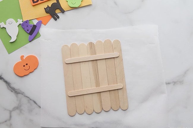 Glue popsicle sticks together