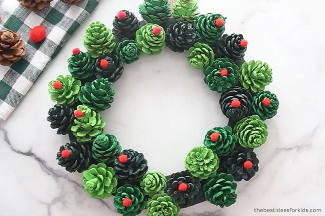 Glue Pom Poms to Pine cone Wreath