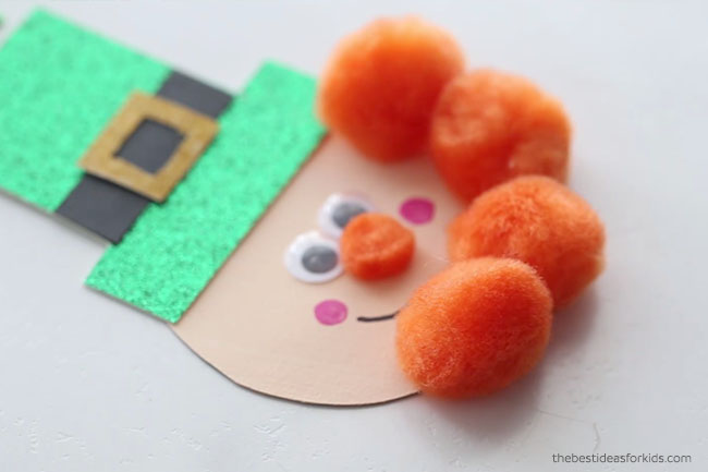 Glue Pom Poms to Leprechaun Face