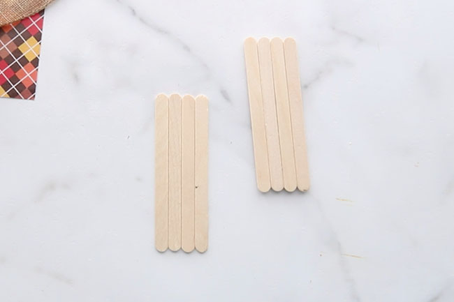 Get 4 popsicle sticks to make the scarecrow