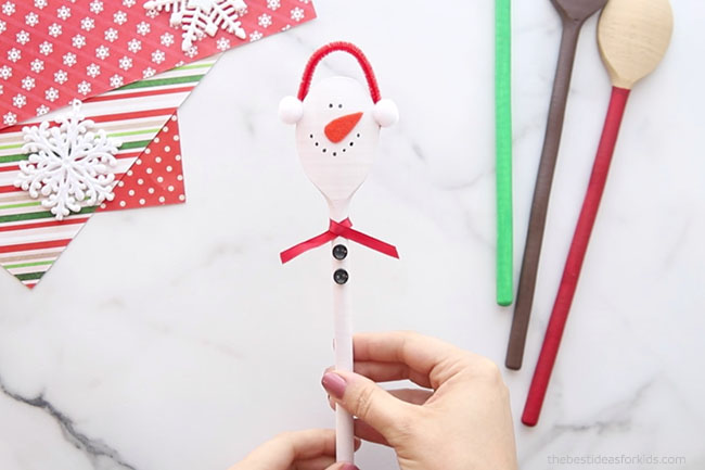 Glue Buttons and Ribbon on Snowman
