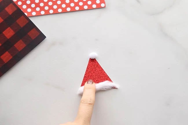 Glue Pom Pom to Santa Hat