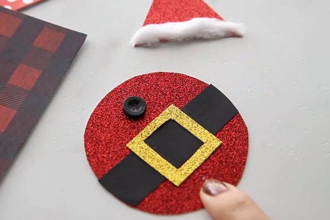 Glue on Button to Santa Body