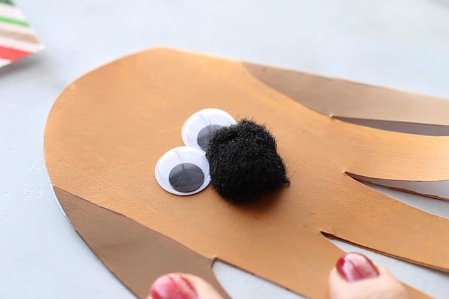 Glue on Googly Eyes and Pom Pom to Max