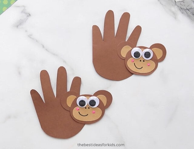Glue monkey head to handprint