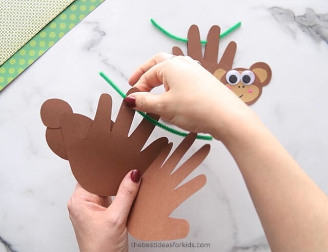 Glue pipe cleaner inside handprint