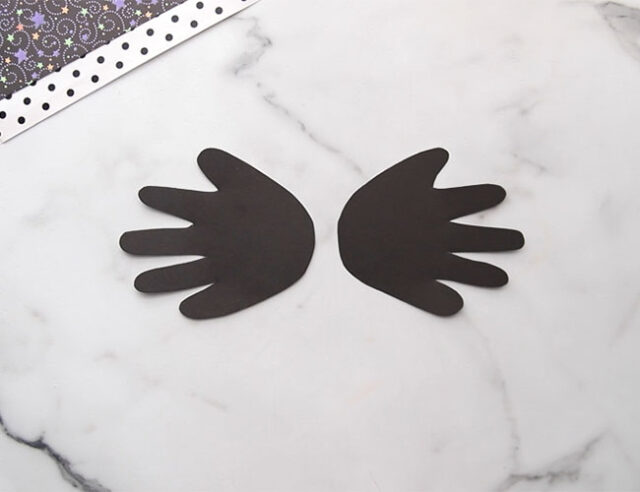 Cut and trace handprints in black
