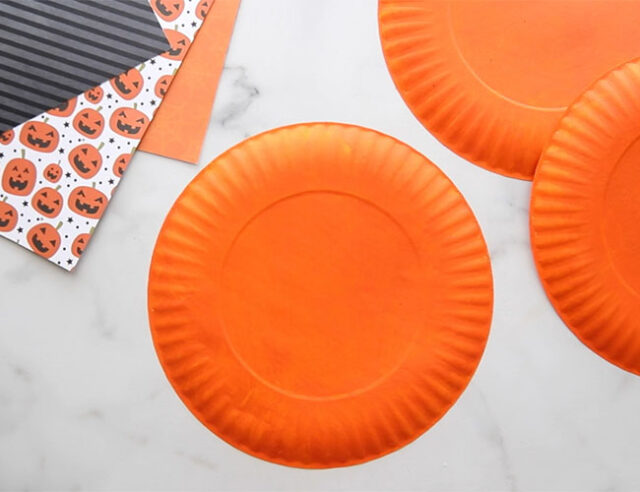 Paint paper plates orange