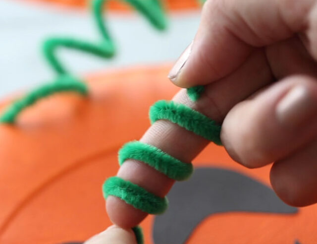 Twist pipe cleaner around finger