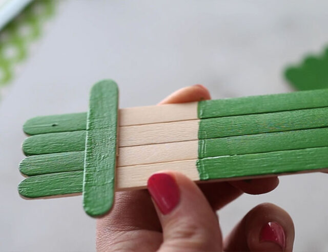 Paint popsicle stick green