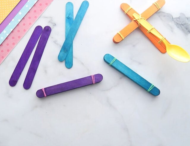 Wrap Elastics Around Popsicle Sticks