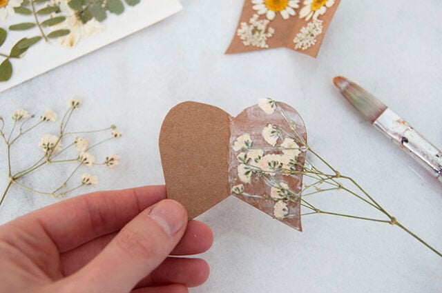 Mod Podge flowers onto wings