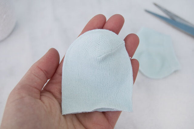 Baby sock cut for snowman hat