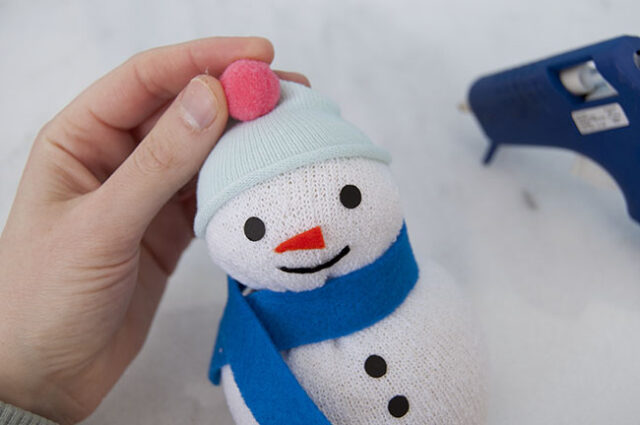 Hat and pom pom on snowman