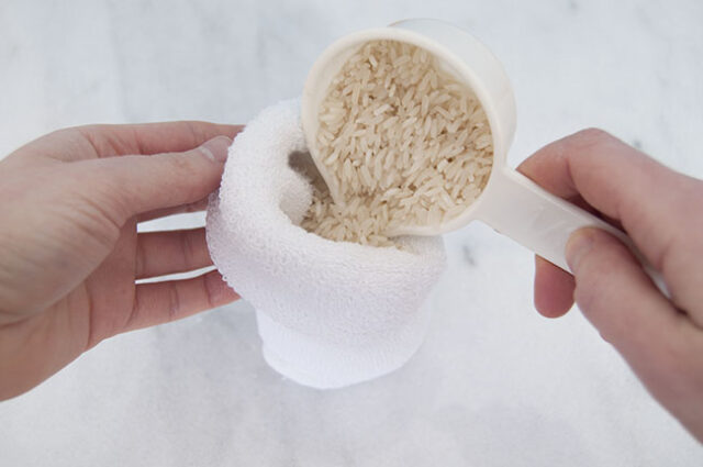 Pouring rice into sock