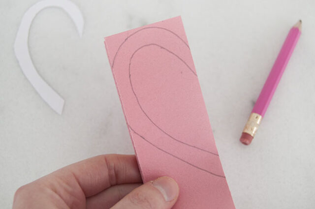 Template on pink folded paper
