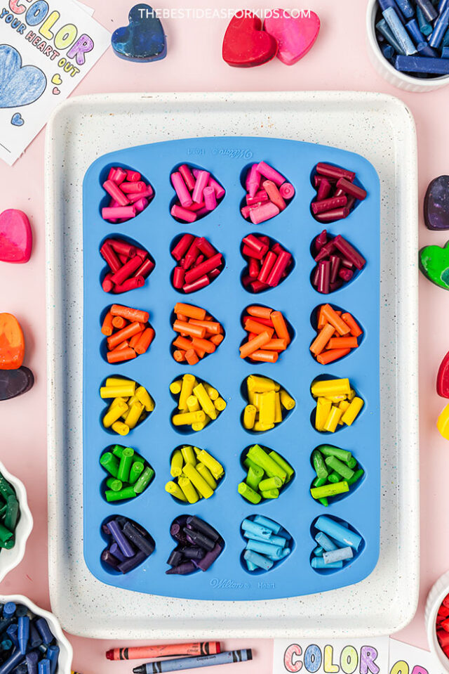 Add crayons into heart mold
