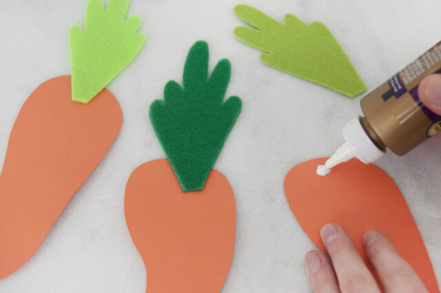 Attaching carrot tops to carrots