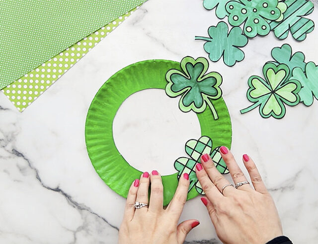 Attaching large clovers to paper plate