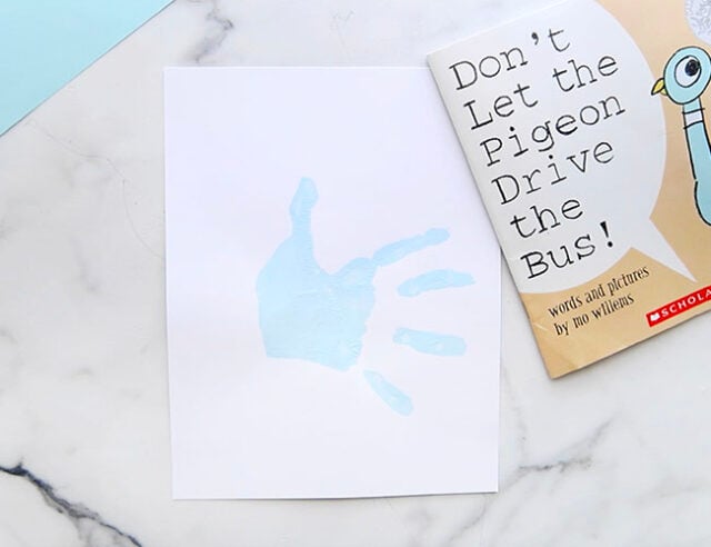 Blue handprint on page