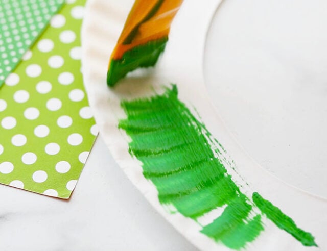 Painting paper plate green