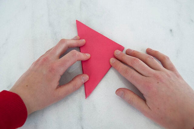 Third fold on red paper