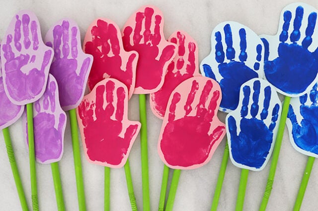 Flowers taped onto straws