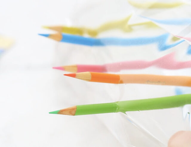 Pencils through bag