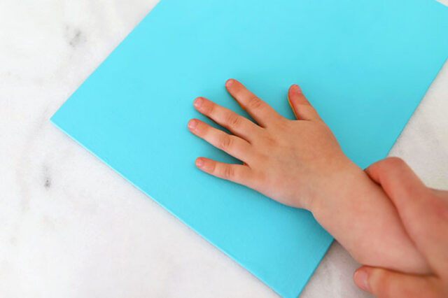 Press hand onto canvas