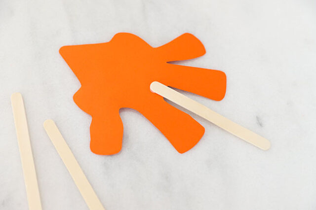 Craft stick glued to scarecrow