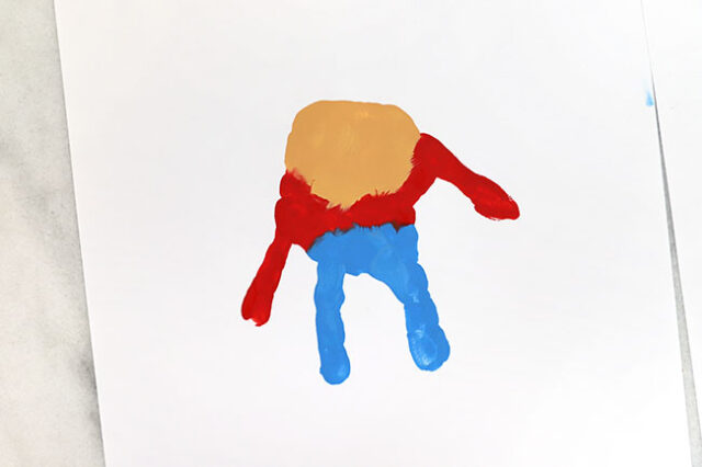 Handprint scarecrow on paper