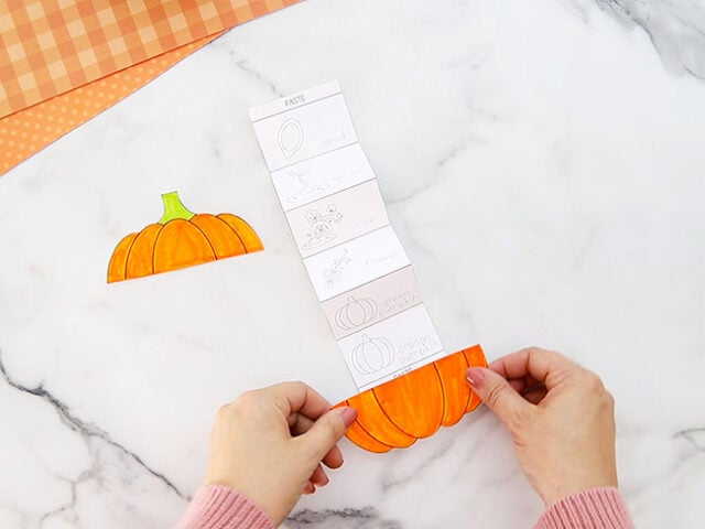 Glue pumpkin halves to top and bottom