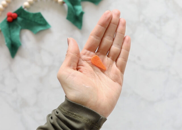 Carrot nose cut from felt