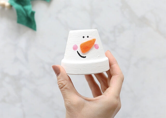 Cheeks stamped onto snowman