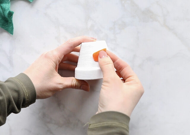 Gluing nose onto pot