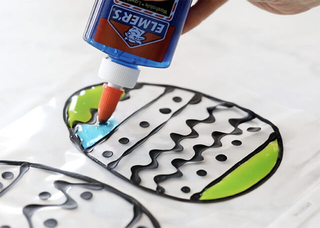 Filling interior of egg with different colors of glue