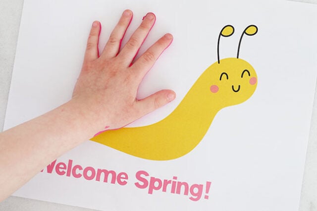 Stamping hand onto paper