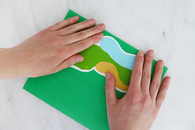Folding green cardstock in half