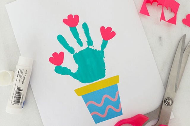 Paper flowers onto handprint cactus