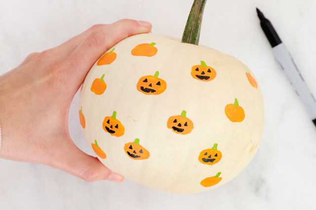 Drawing faces onto pumpkins