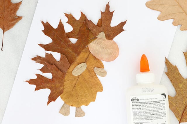 Glueing leaves into hedgehog