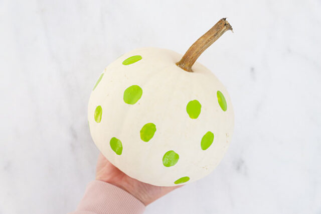 Green Frankenstein dots all over pumpkin