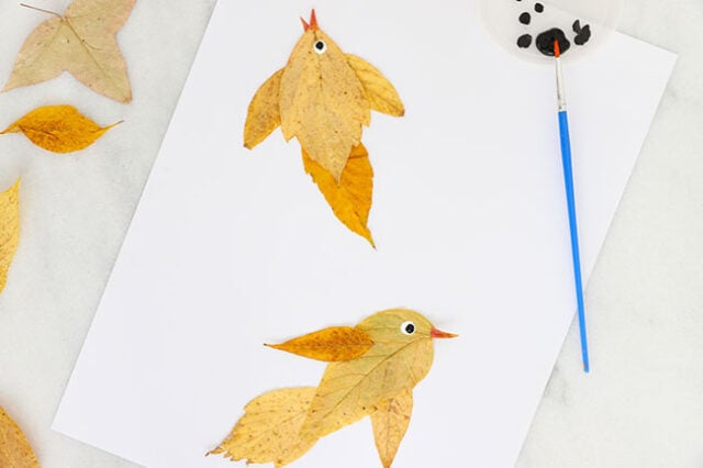 Painting eye details onto leaf bird