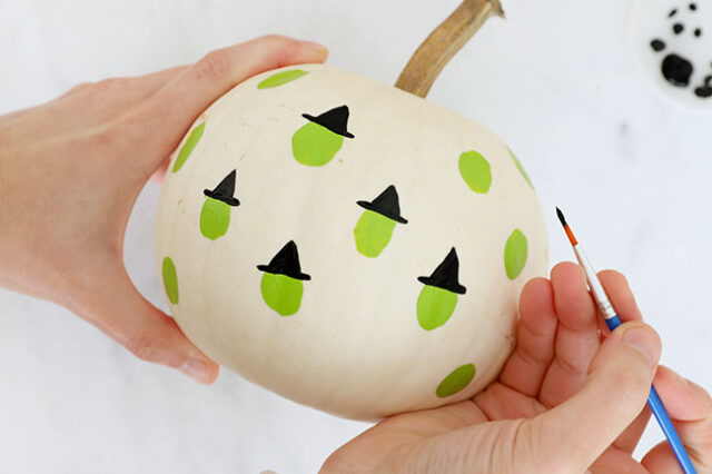 Painting witch hats onto heads